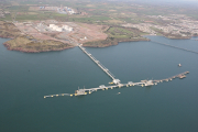 An aerial view of a coastal LNG dock